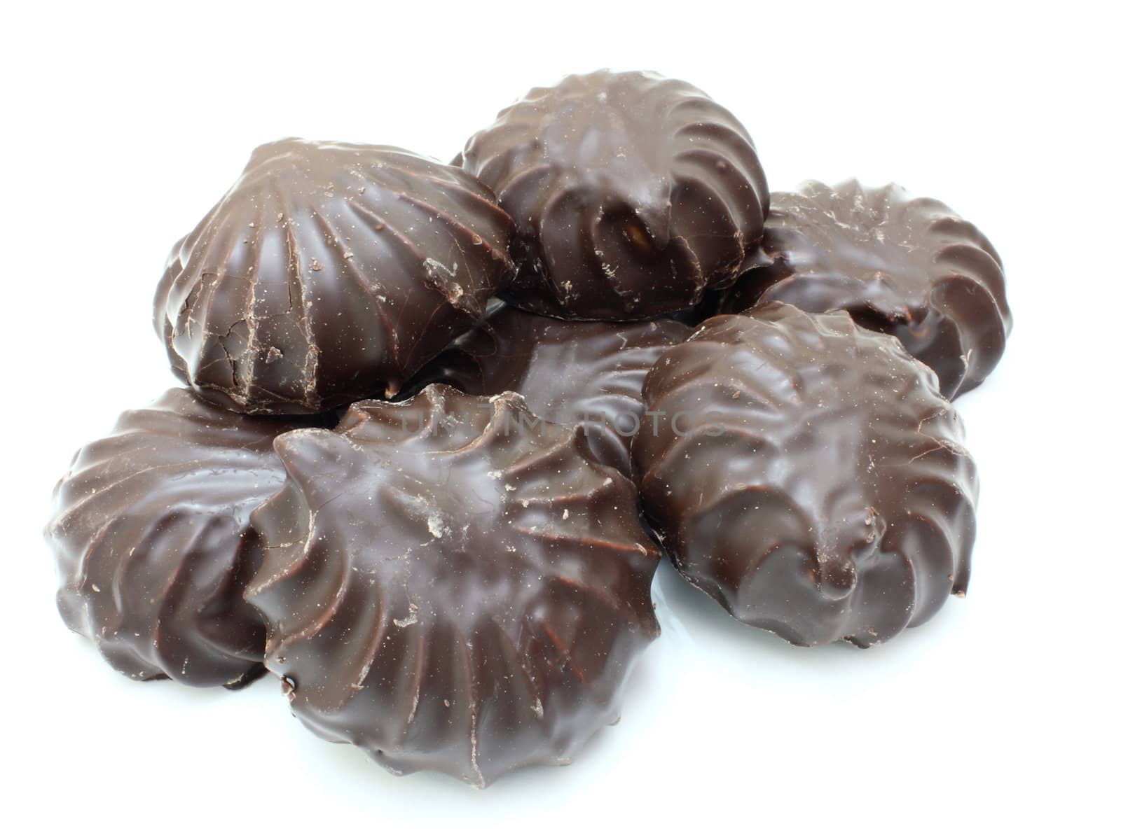 Marshmallow of black color lies on a white background