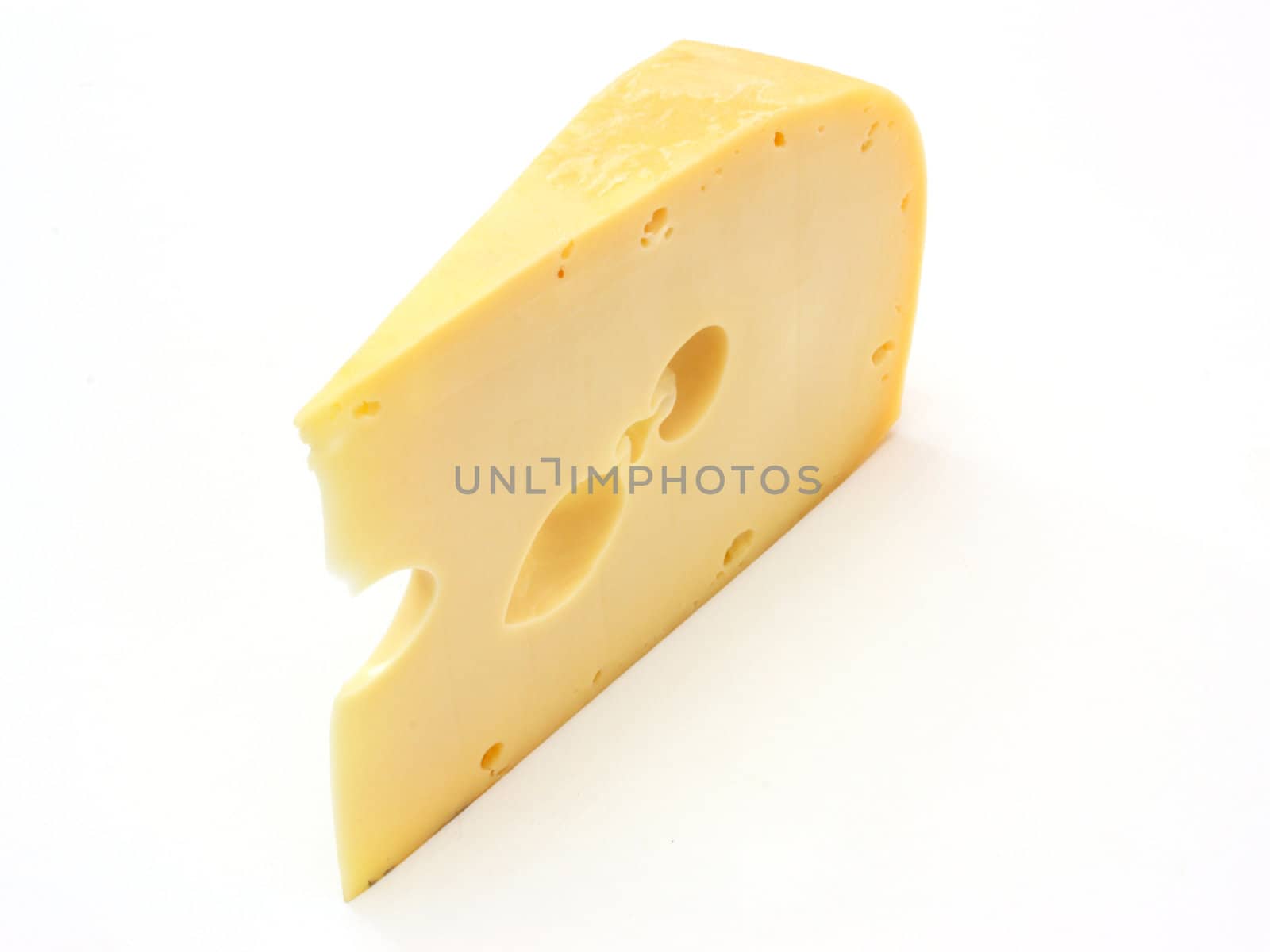 A piece of Swiss cheese isolated on white yellow delicatessen;