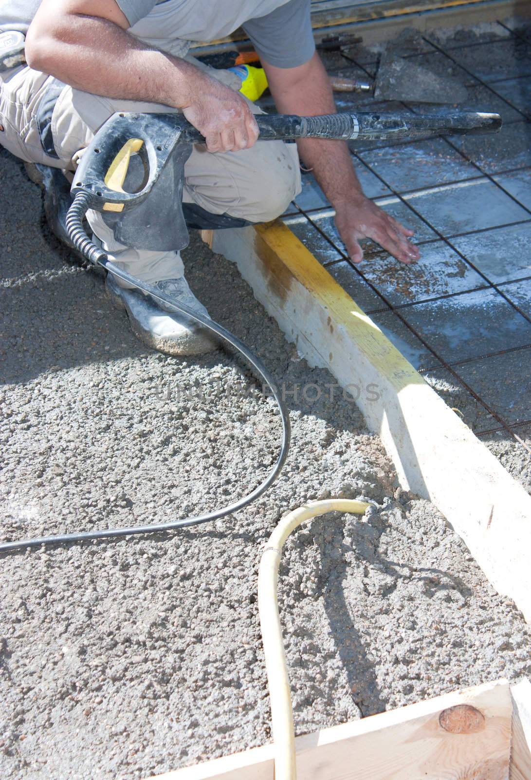 Mason building a screed coat cement