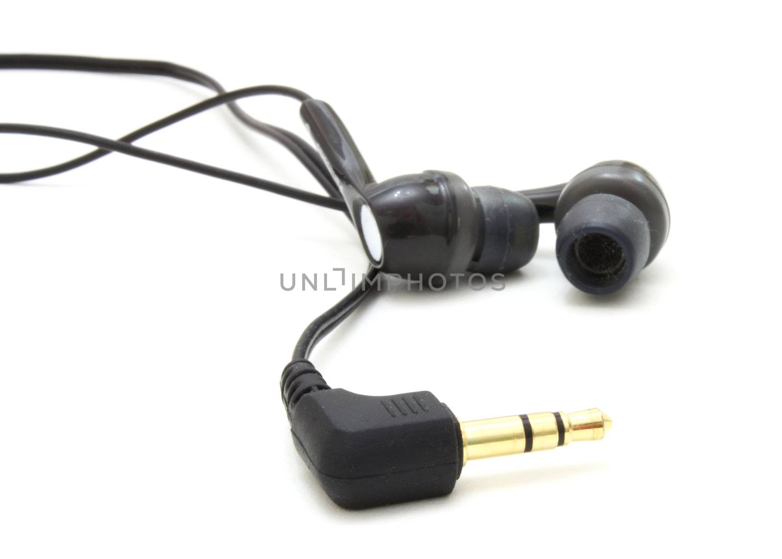 Small ear-phones and the tip for connection on a white background