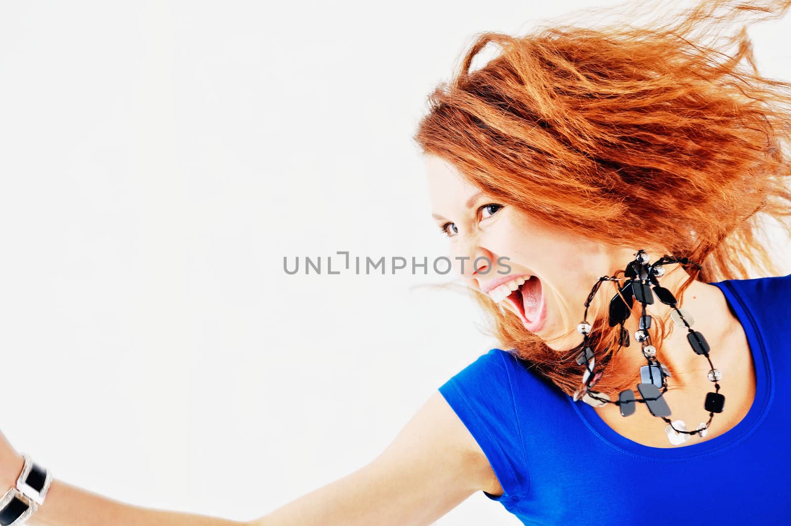 Attractive young redhead woman isolated on white background