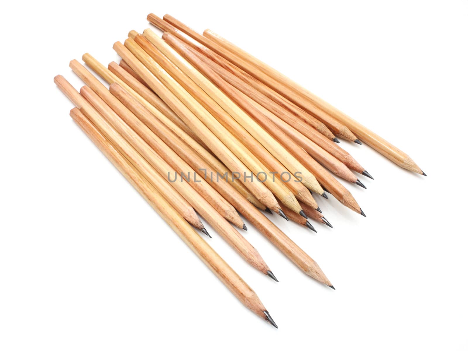 The yellow ground pencil lies is isolated on a snow-white background