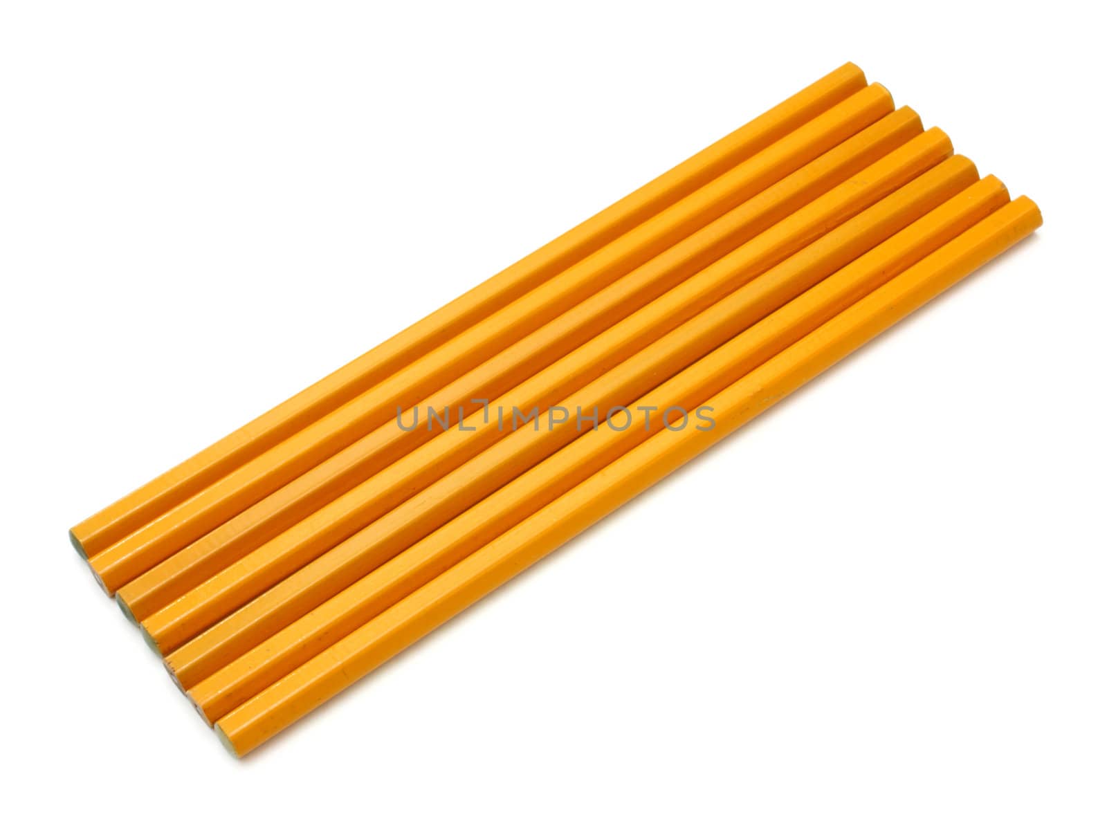 The yellow ground pencil lies is isolated on a snow-white background