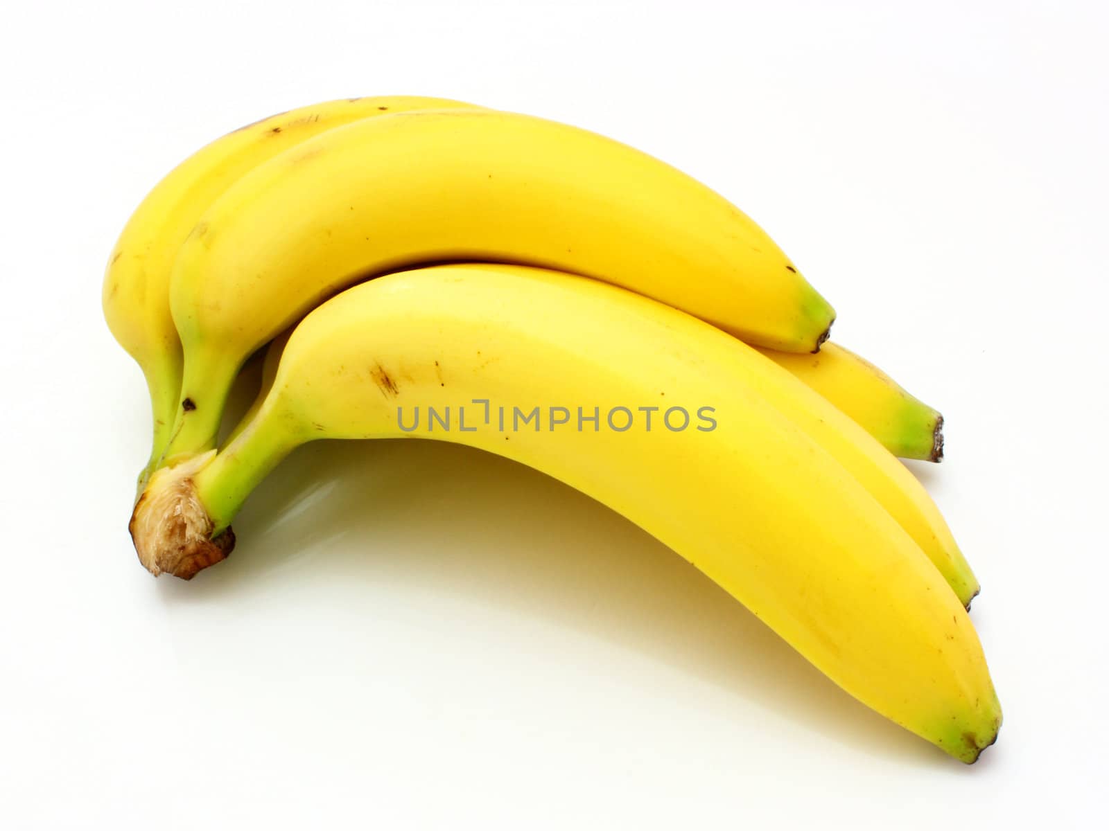Yellow bananas apples and pears a still-life on a white background