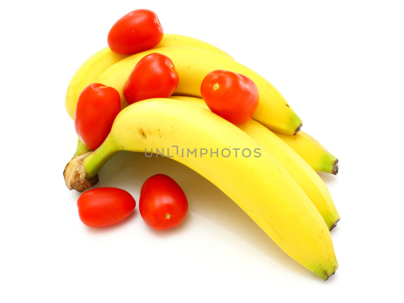 Yellow bananas apples and pears a still-life on a white background