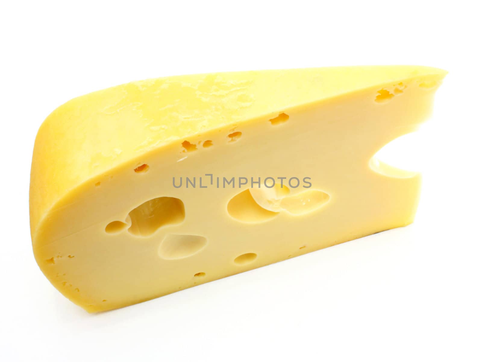 A piece of Swiss cheese isolated on white yellow delicatessen;