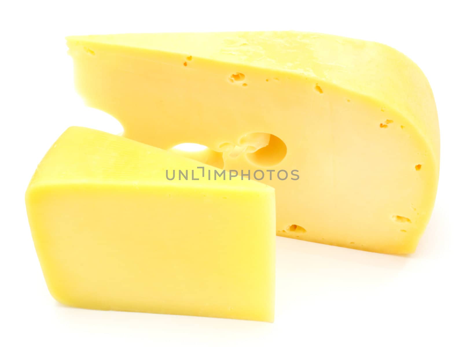 A piece of Swiss cheese isolated on white yellow delicatessen;
