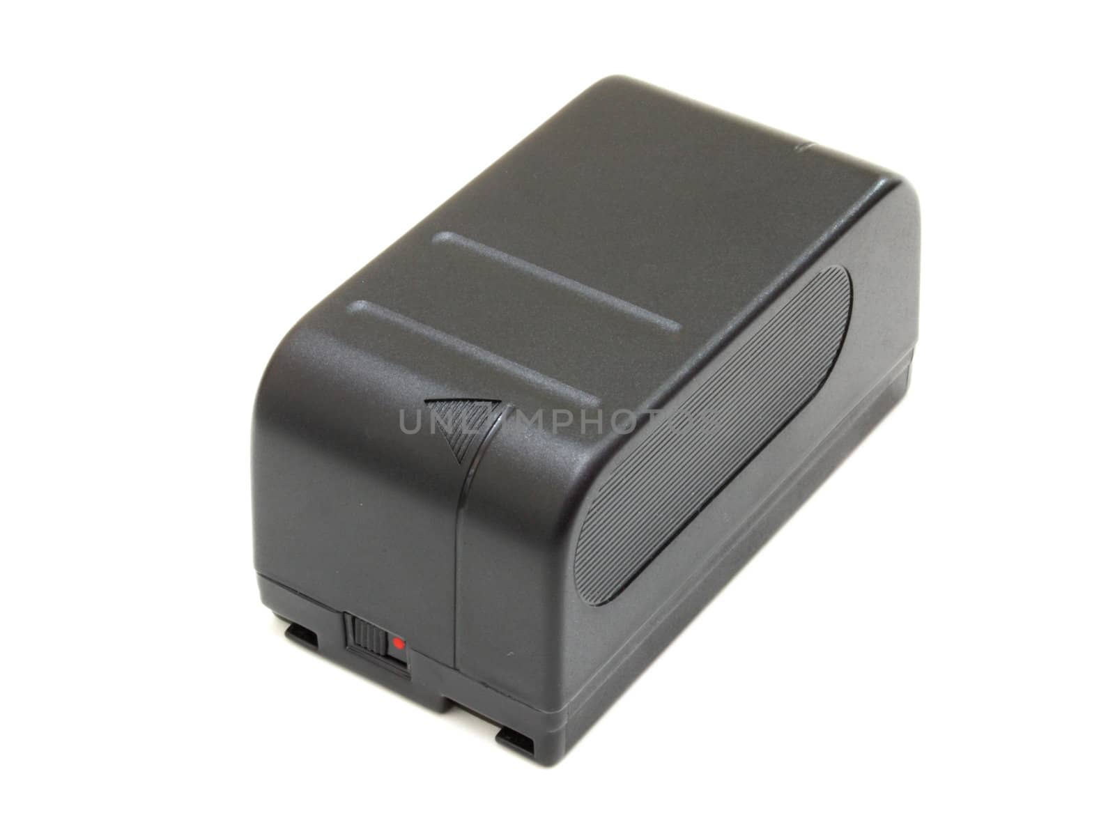 The black small rectangular accumulator from a videocamera on a white background