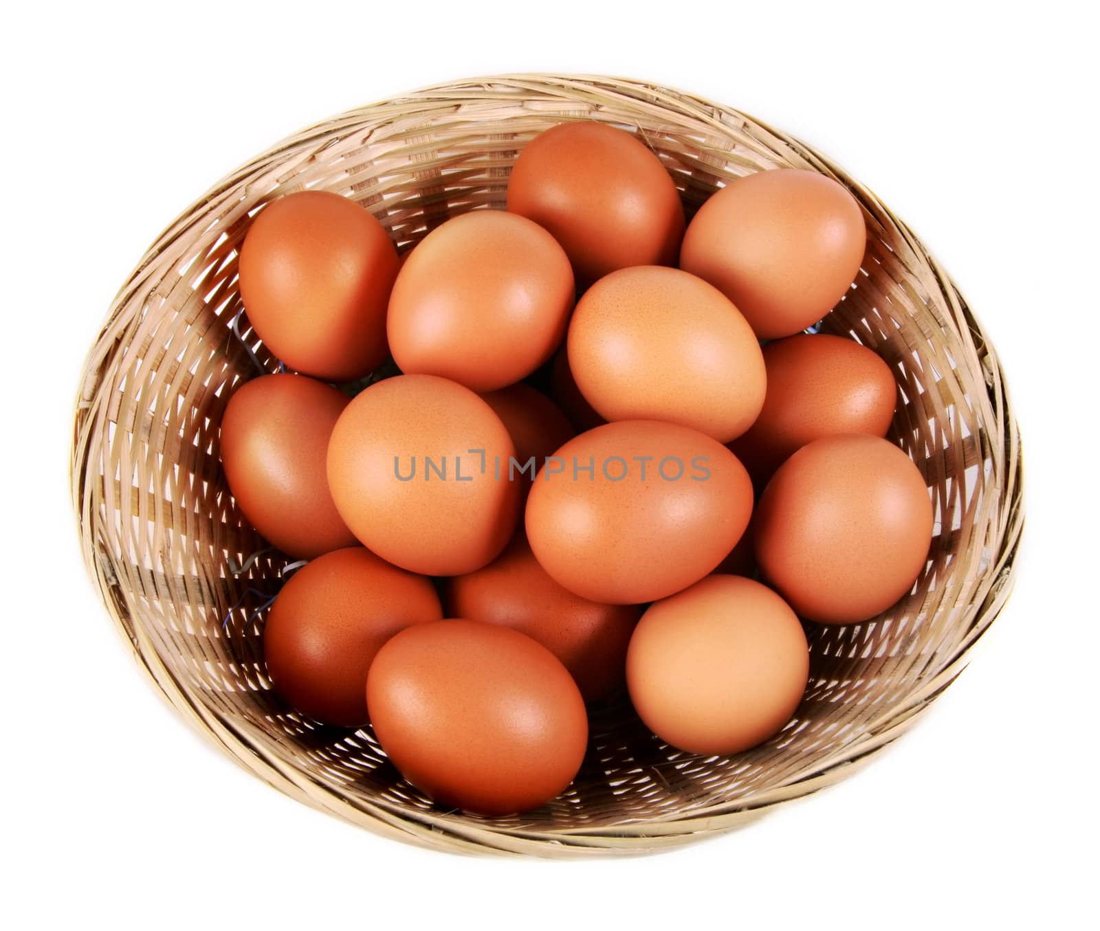 Eggs in a basket isolated on white