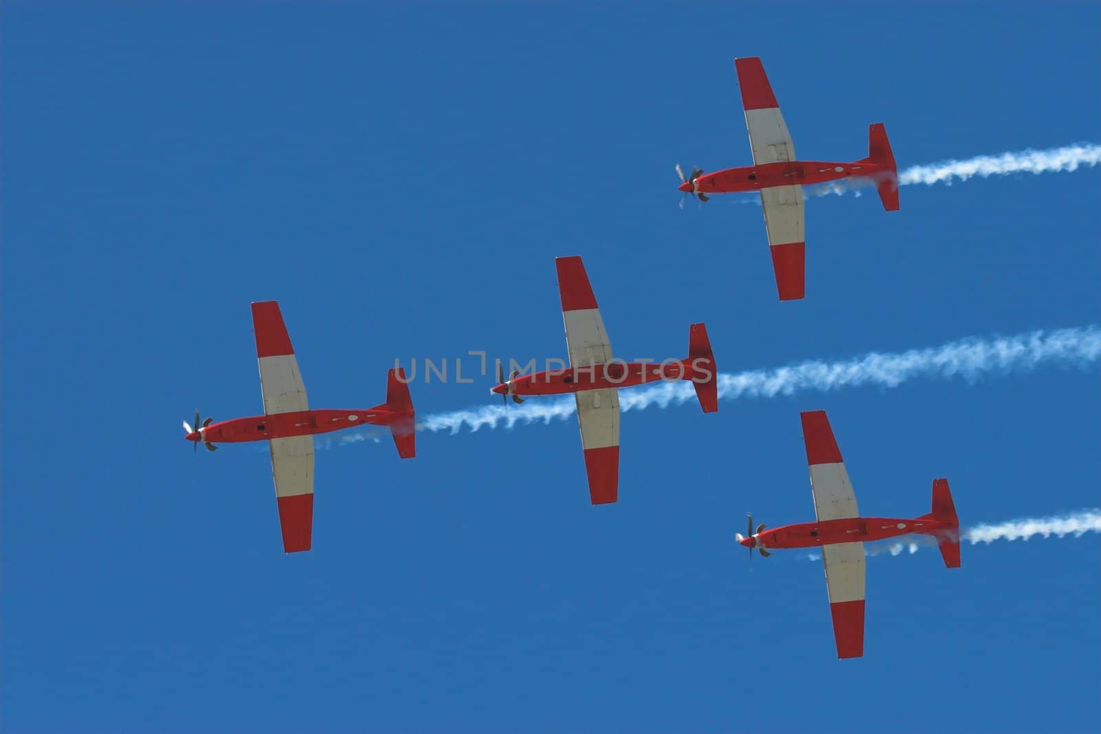 Four Prop planes flying in formation at an airshow