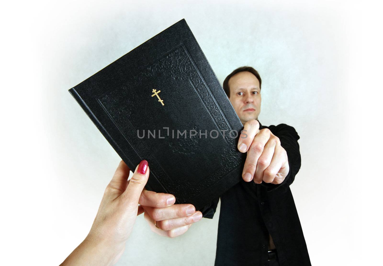 The man transfers the woman the bible