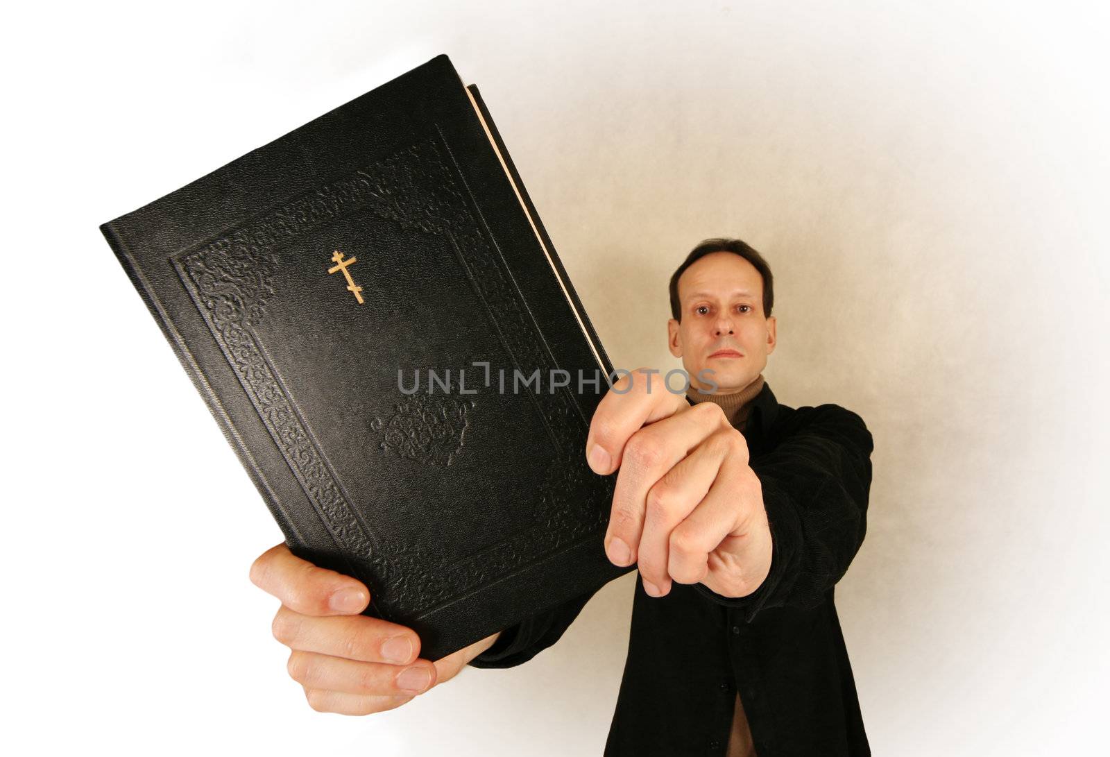 Man with the bible on a light background