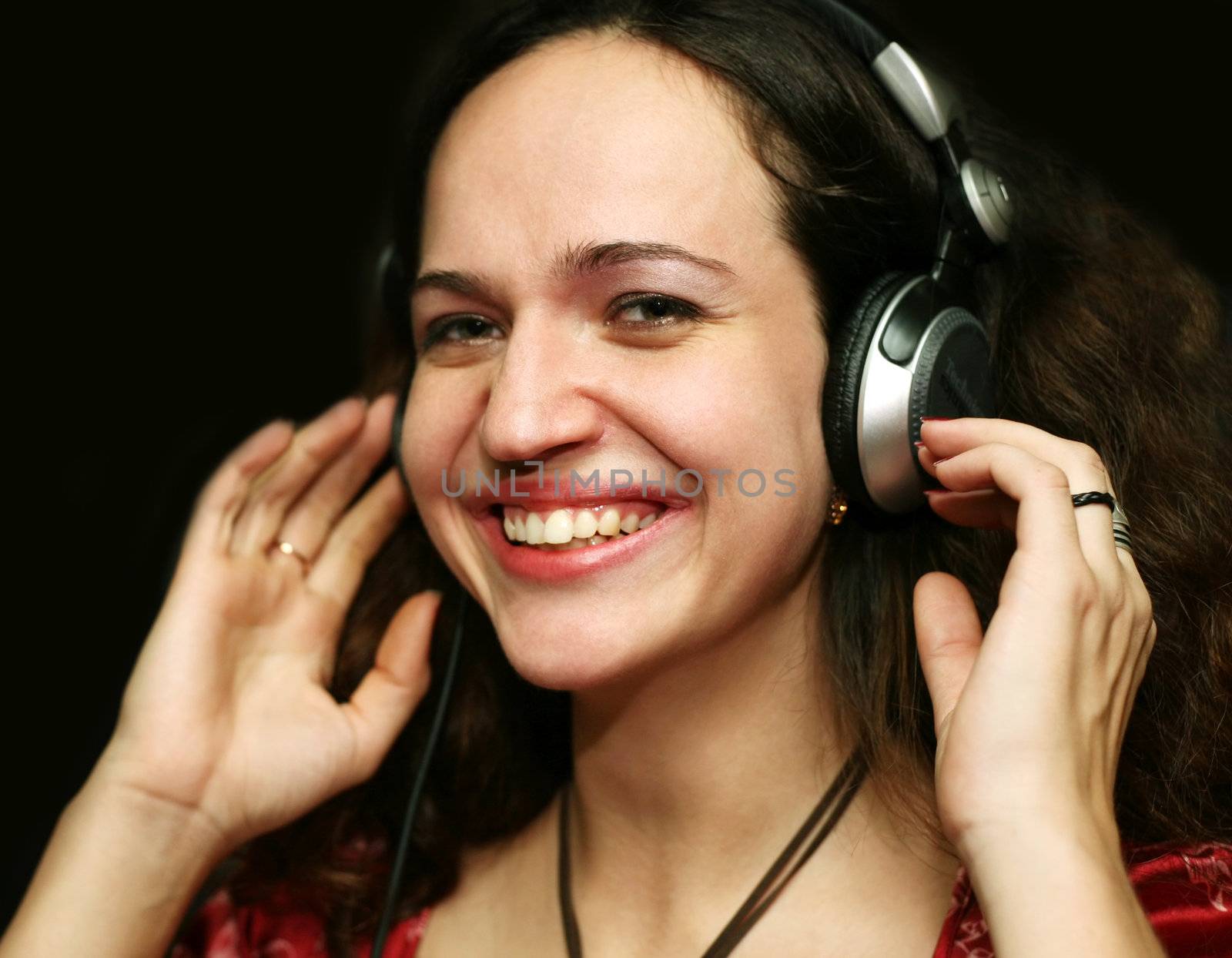 The girl in headphones in a night club