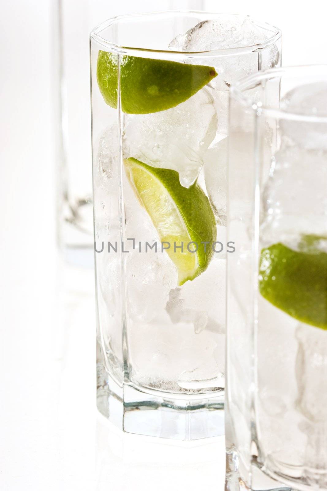 drink series: cold cocktail with ice and lime