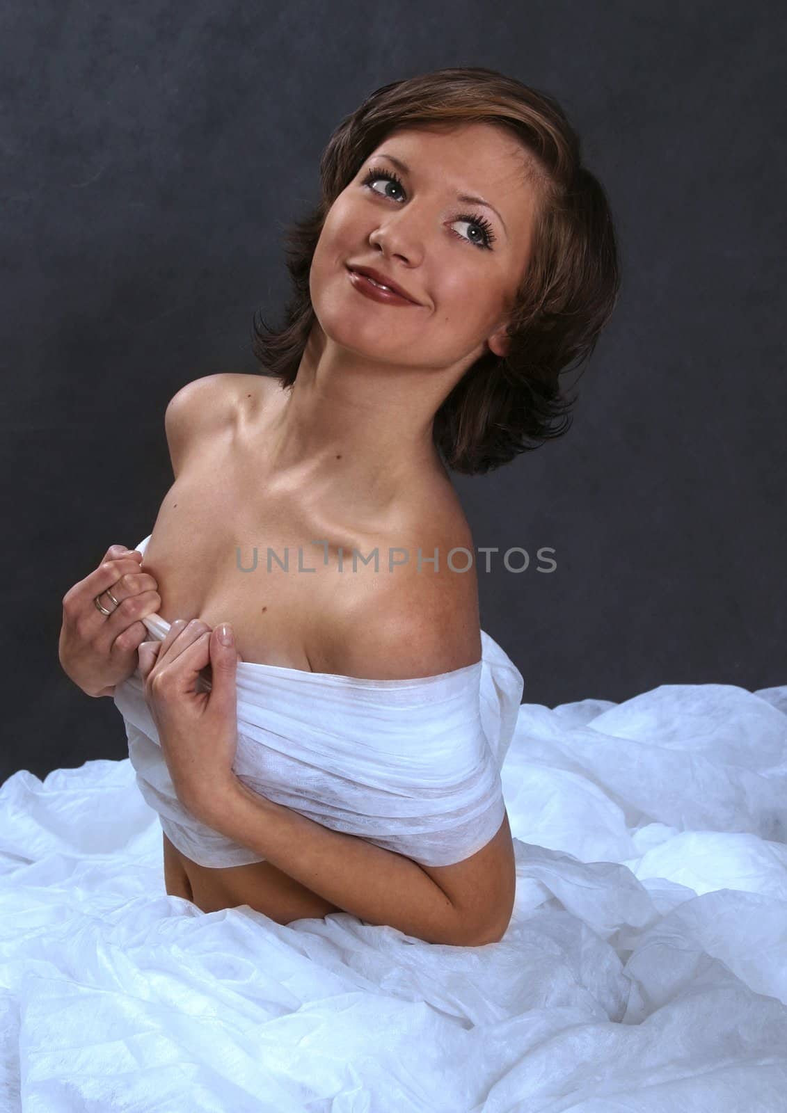 Portrait of the girl in a blue dress in studio