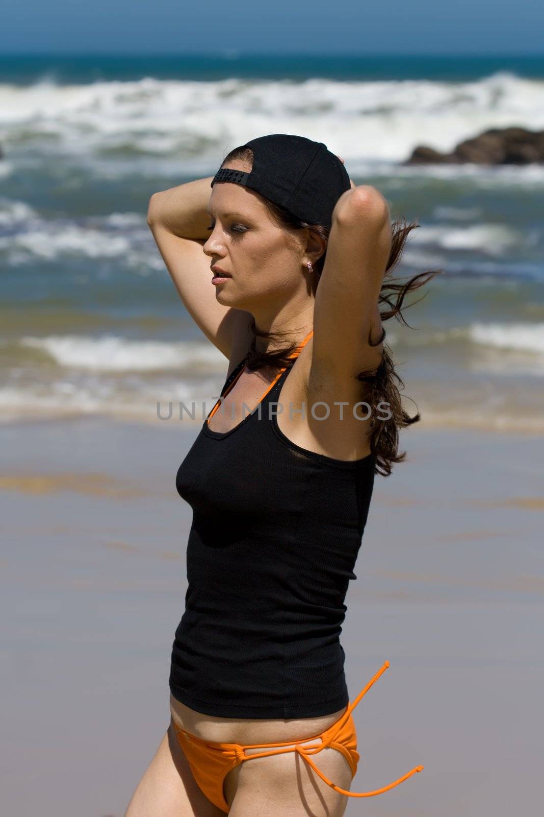 Fitness model running with her arms up