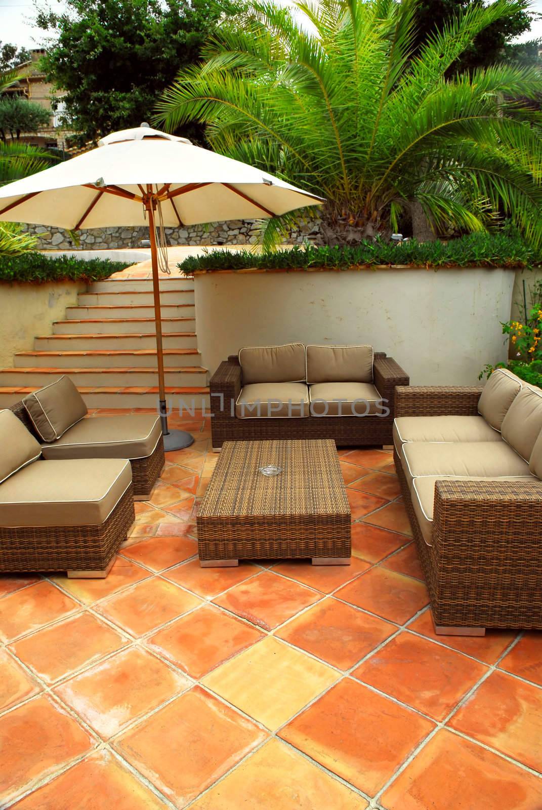 Patio of mediterranean villa in French Riviera with wicker furniture