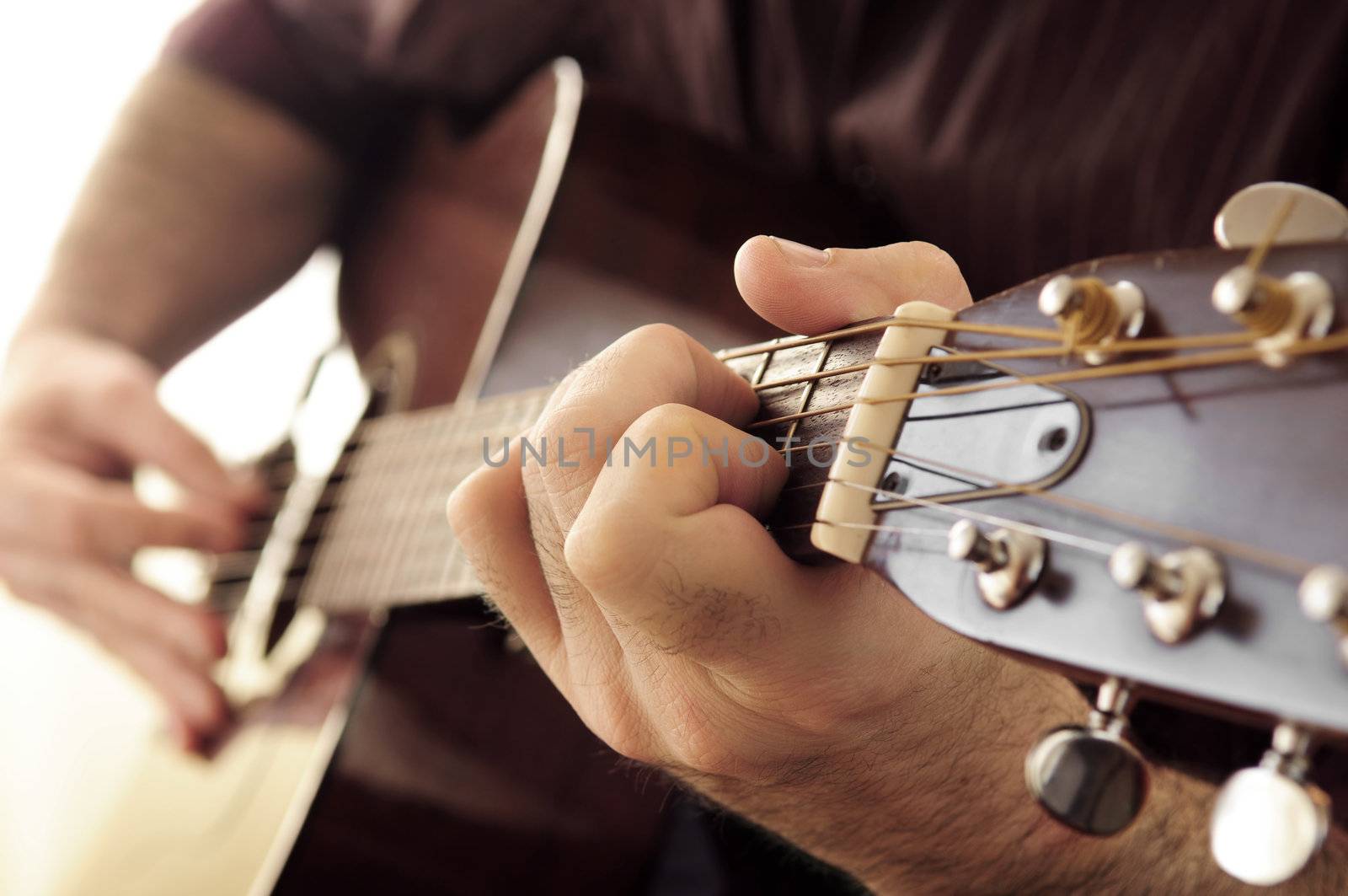 Man playing a guitar by elenathewise