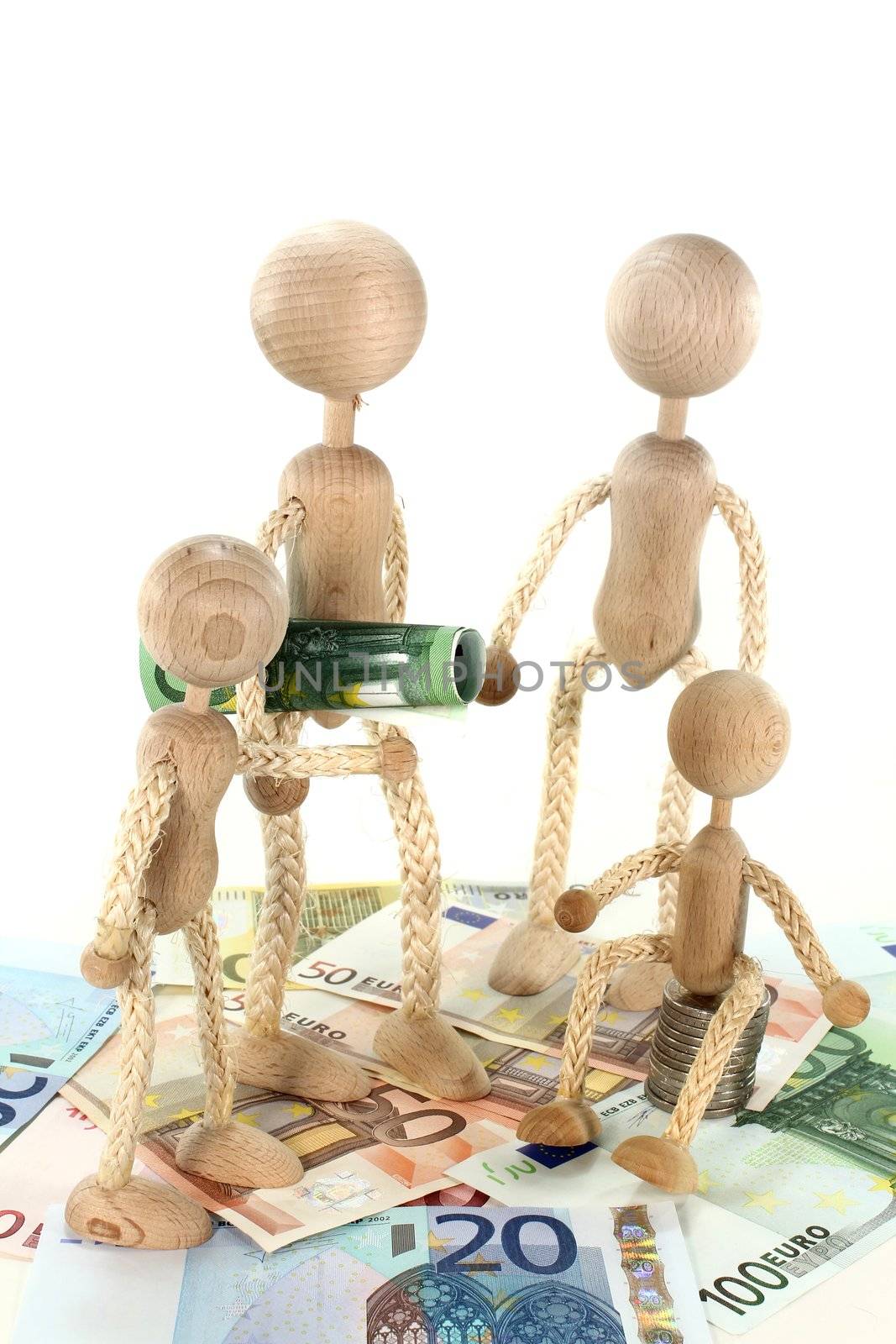 a family of wooden dolls and Euro notes