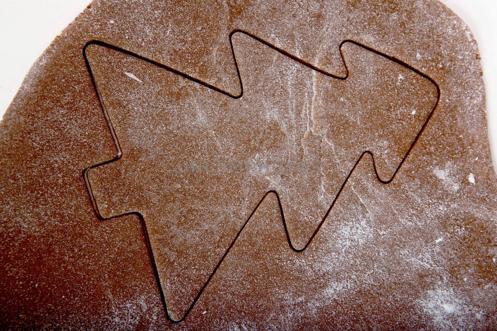 Baking homemade Gingerbread christmas cookies with a shape of a tree