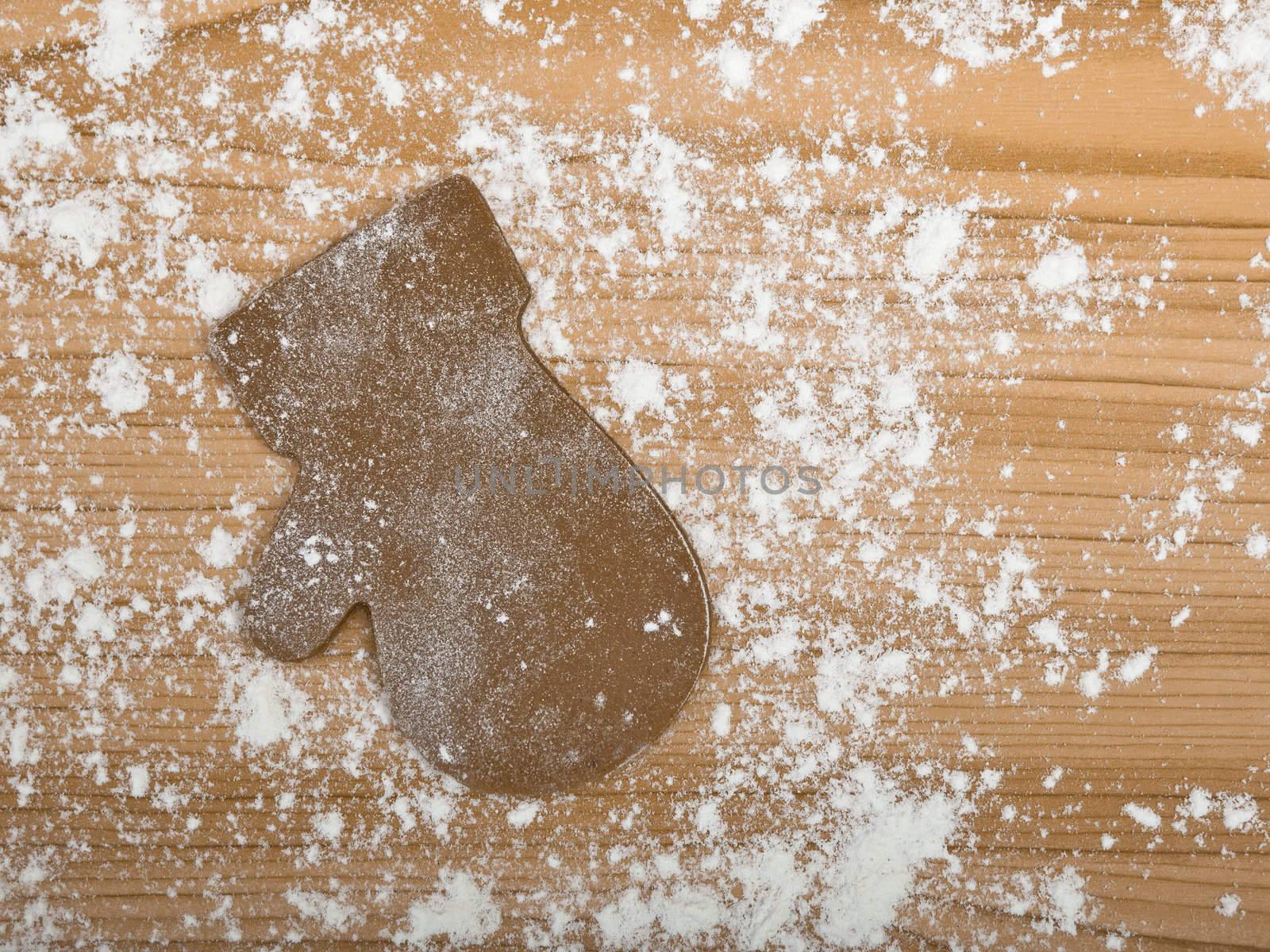 Baking homemade Gingerbread christmas cookies with a shape of a glove