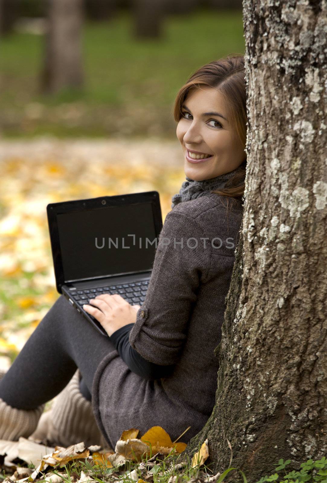 Beautiful woman working with a laptop in outdoor