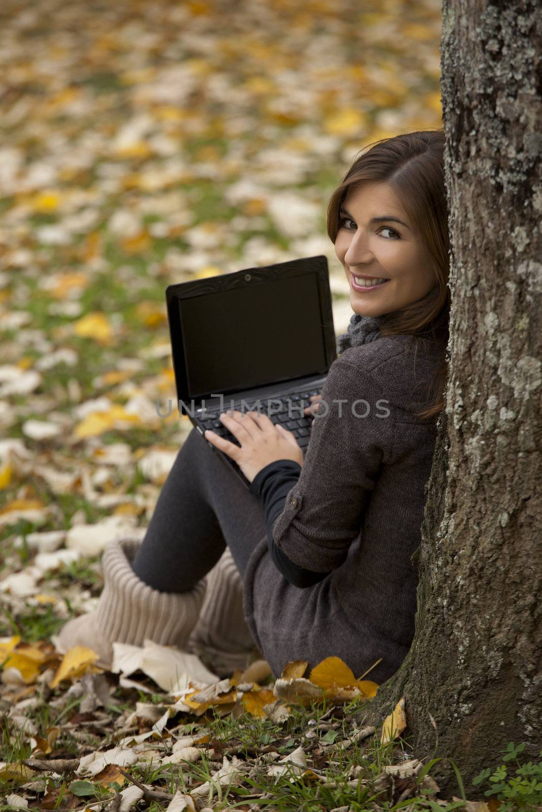 Beautiful woman working with a laptop in outdoor