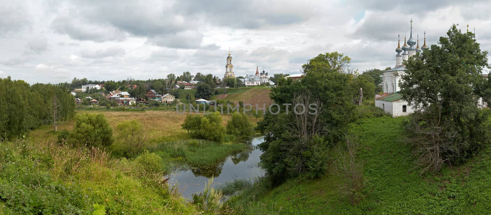 best view of Suzdal.Russia. XXXL detailed panorama of meadow, forest, lake and buildings