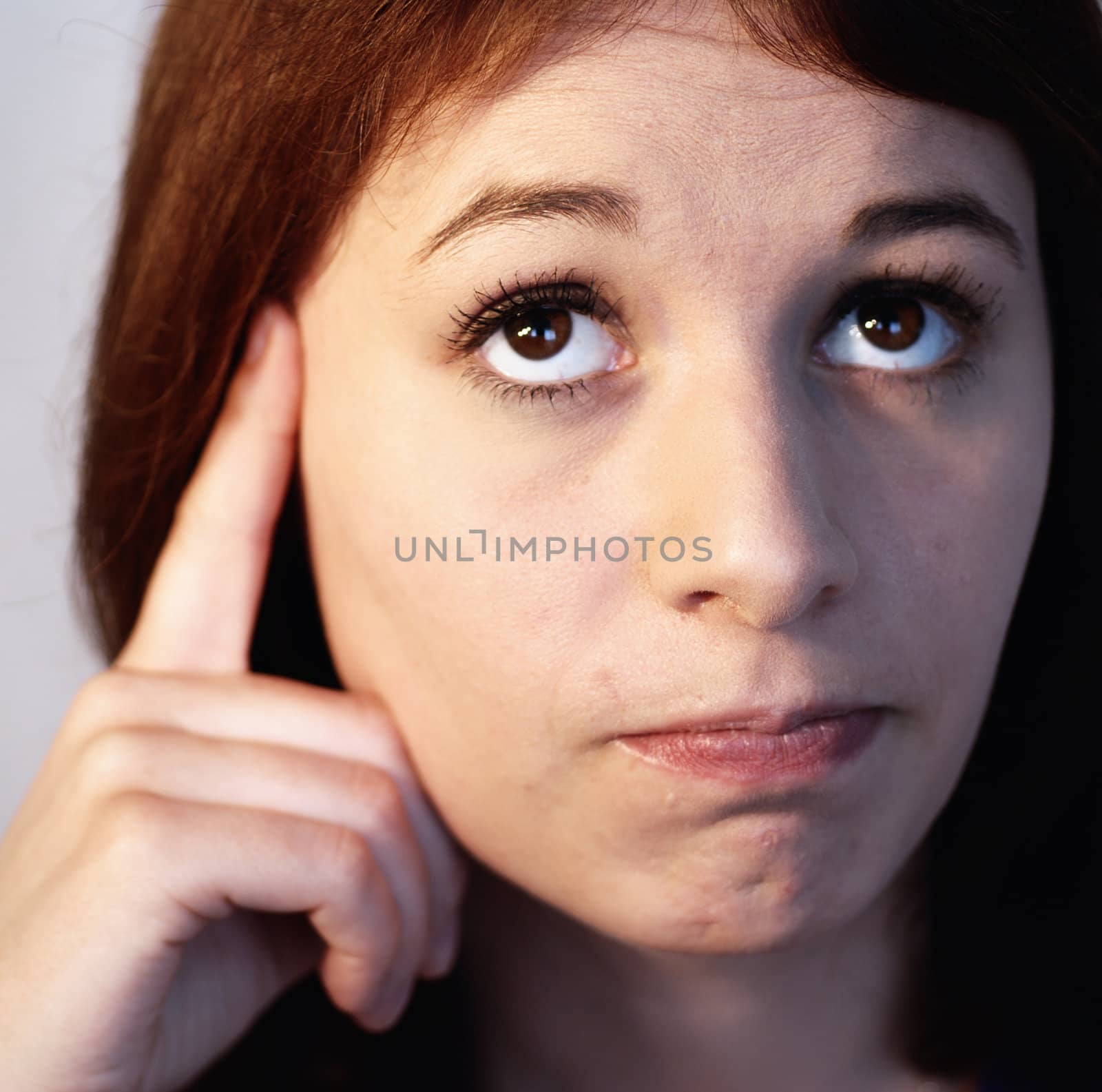 Young pensive woman expressing thoughtful.