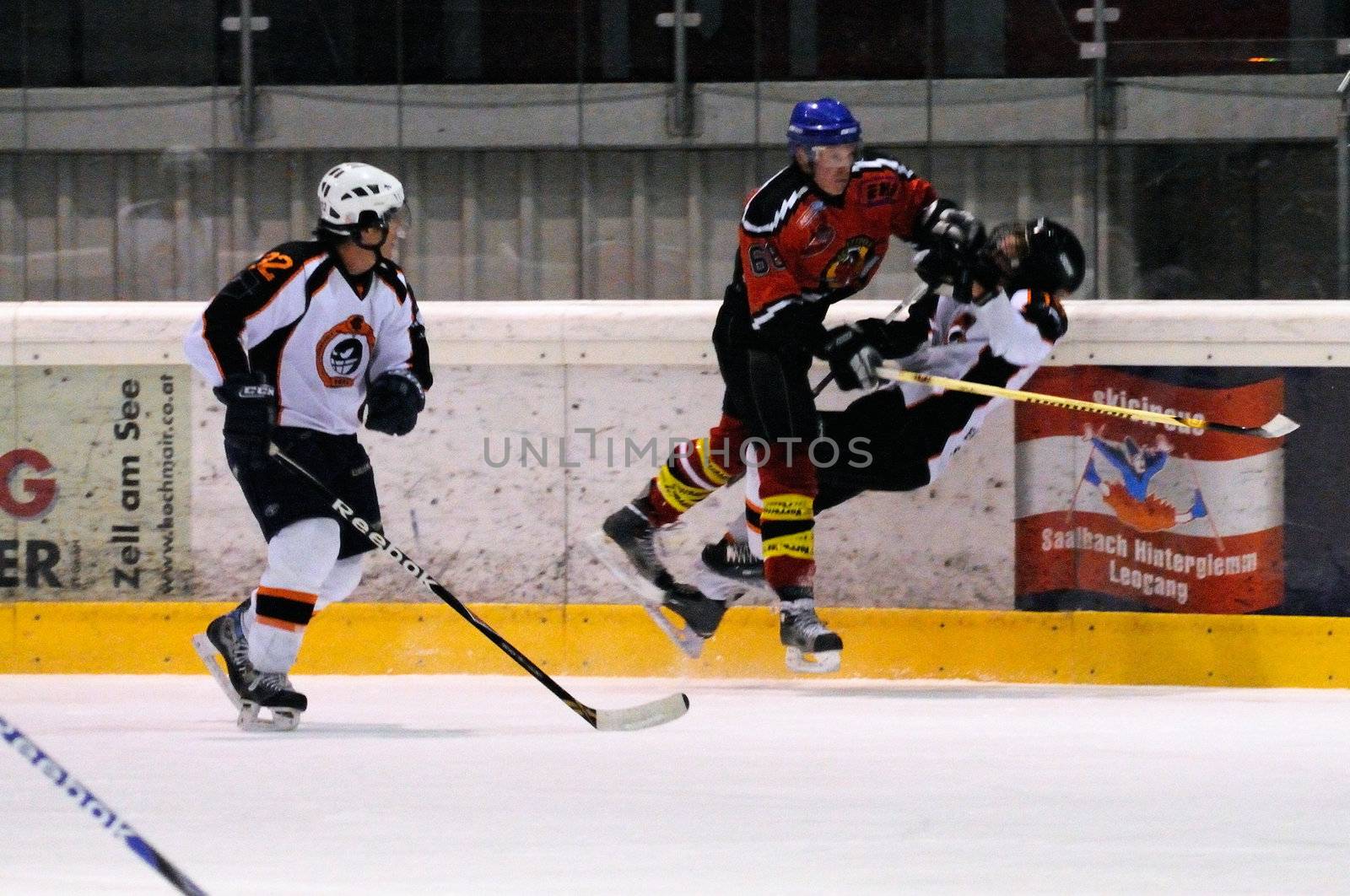 ZELL AM SEE, AUSTRIA - MARCH 19: Salzburg hockey League. Leitgob nails Salzburg player Game SV Schuettdorf vs Salzburg Sued  (Result 10-4) on March 19, 2011, at the hockey rink of Zell am See.