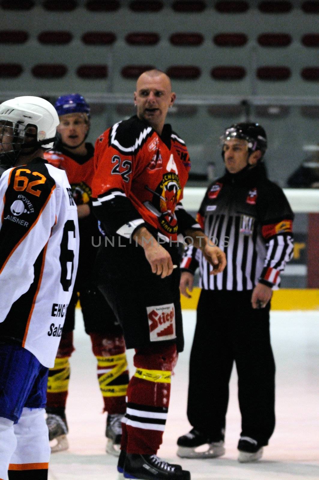 ZELL AM SEE, AUSTRIA - MARCH 19: Salzburg hockey League. Fight between Markus Ralser and Salzburg player. Game SV Schuettdorf vs Salzburg Sued  (Result 10-4) on March 19, 2011, at the hockey rink of Zell am See.