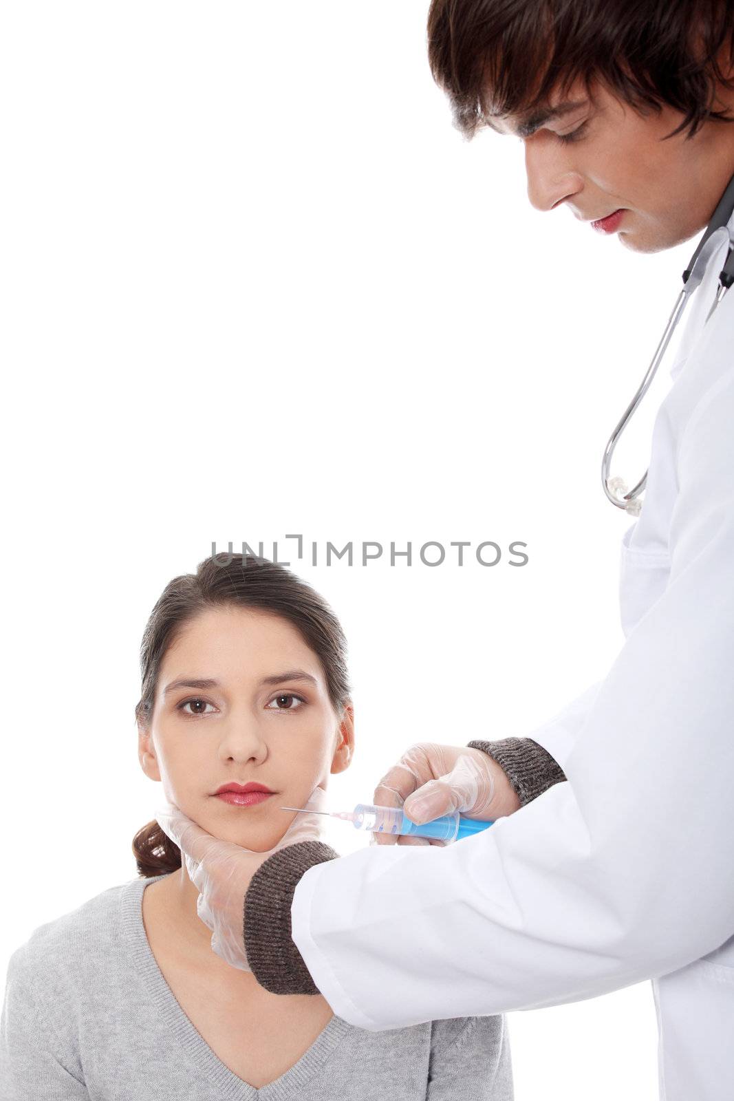 Plastic surgeons giving botox injection in female skin. Isolated on white