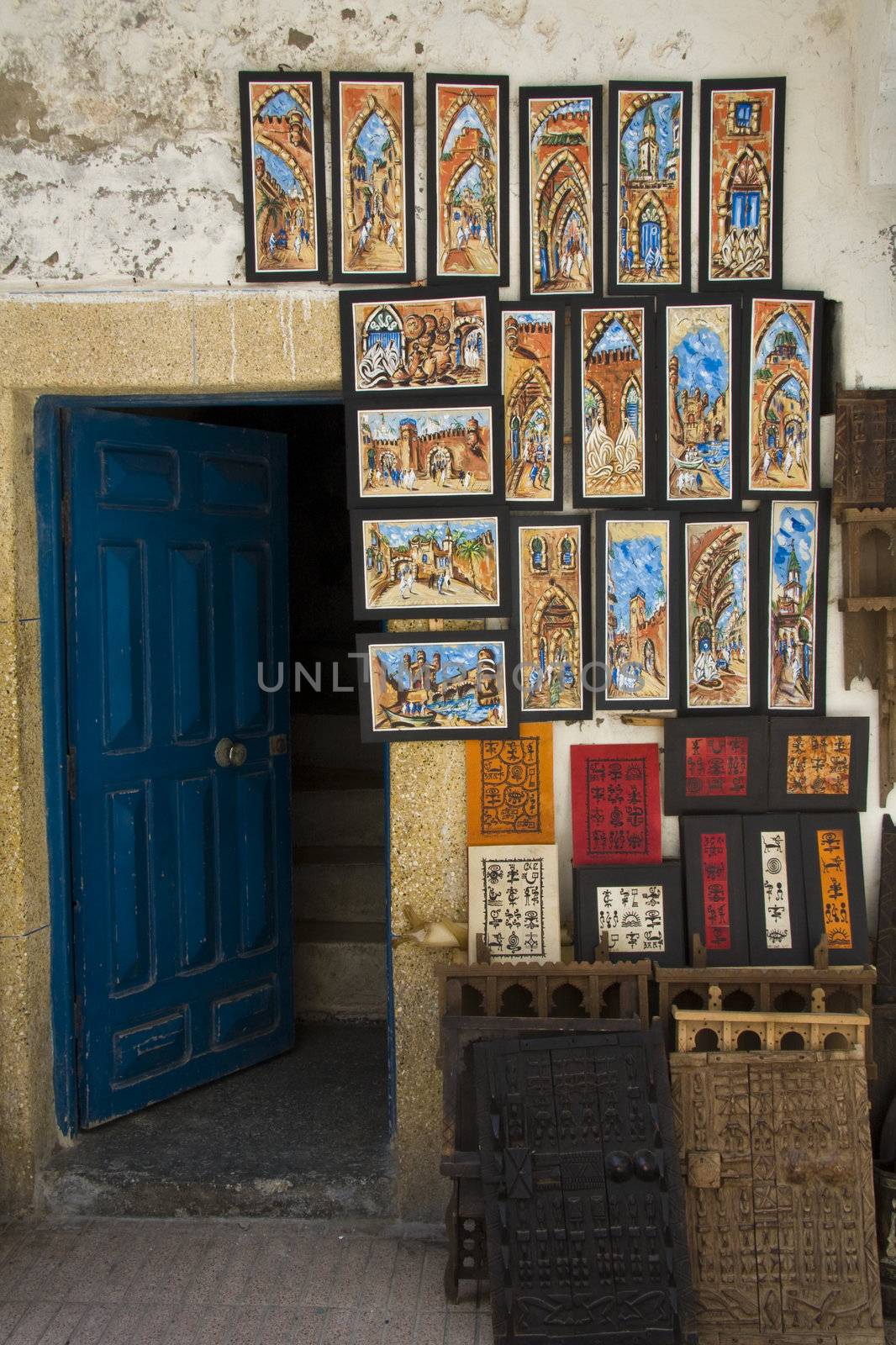 Paintings hanging outside a shop in Essaouira, Morocco