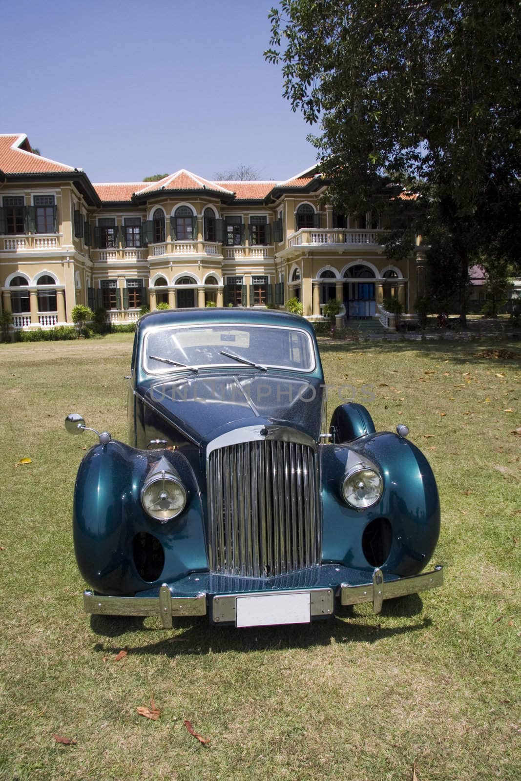 Vintage car and mansion
