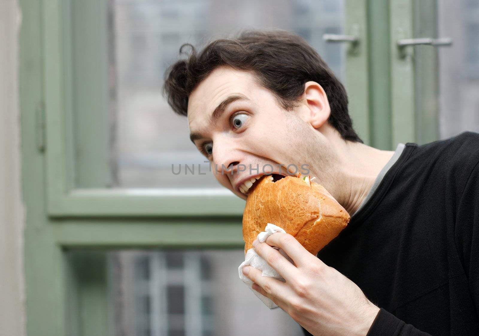 Man eating with a funny expression