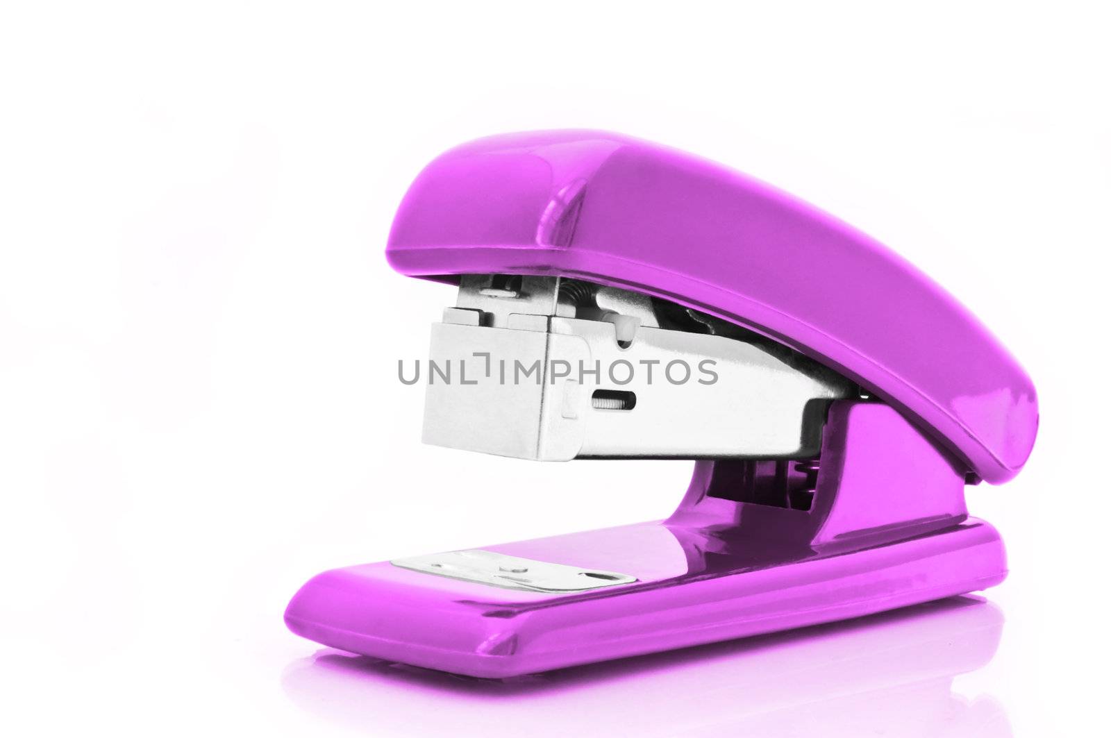 Close up of a single pink office stapler isolated over white