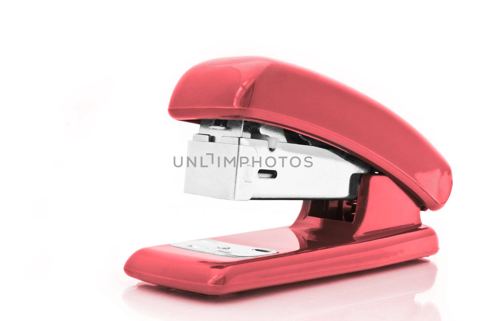 Close up of a single red office stapler isolated over white