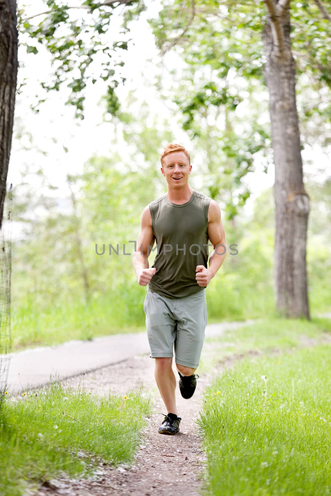 Young man jogging by leaf