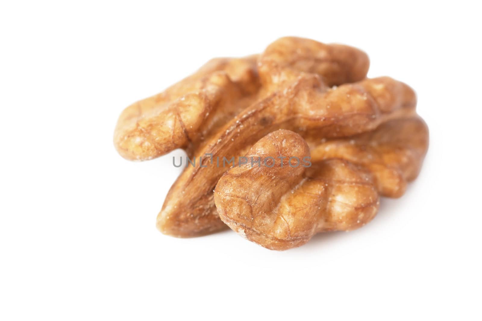 Closeup view of a half of walnut isolated over white