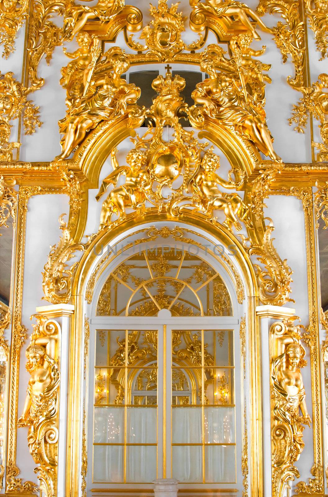 beautiful wall with large door, golden candelabras and decorations in Catherine Palace