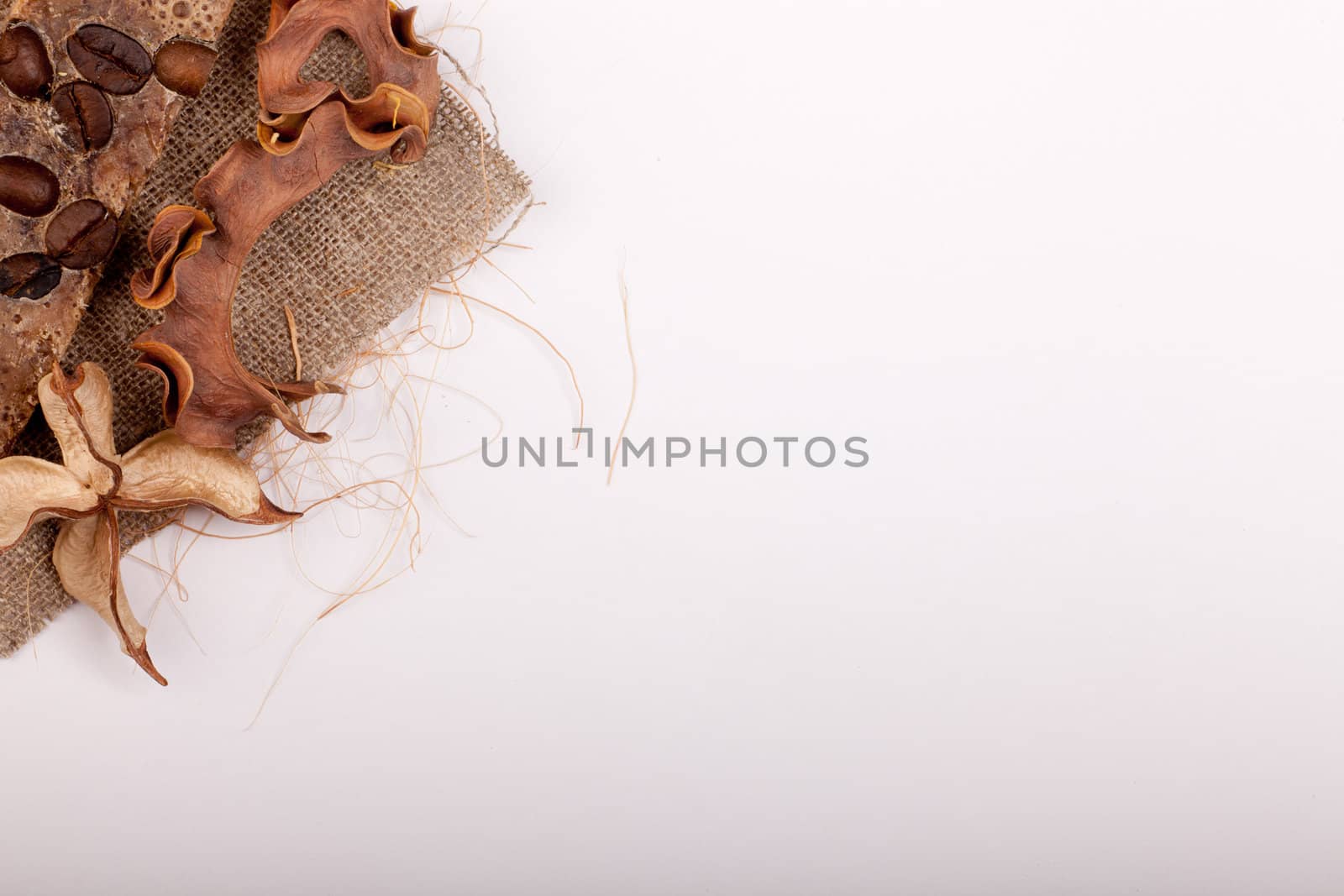 some coffee beans and brown decoration leaving copyspace