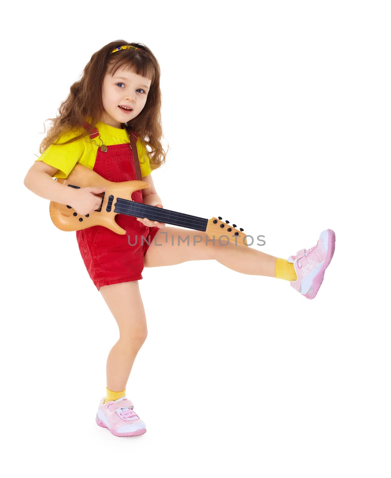 A little girl with a toy guitar isolated on white background