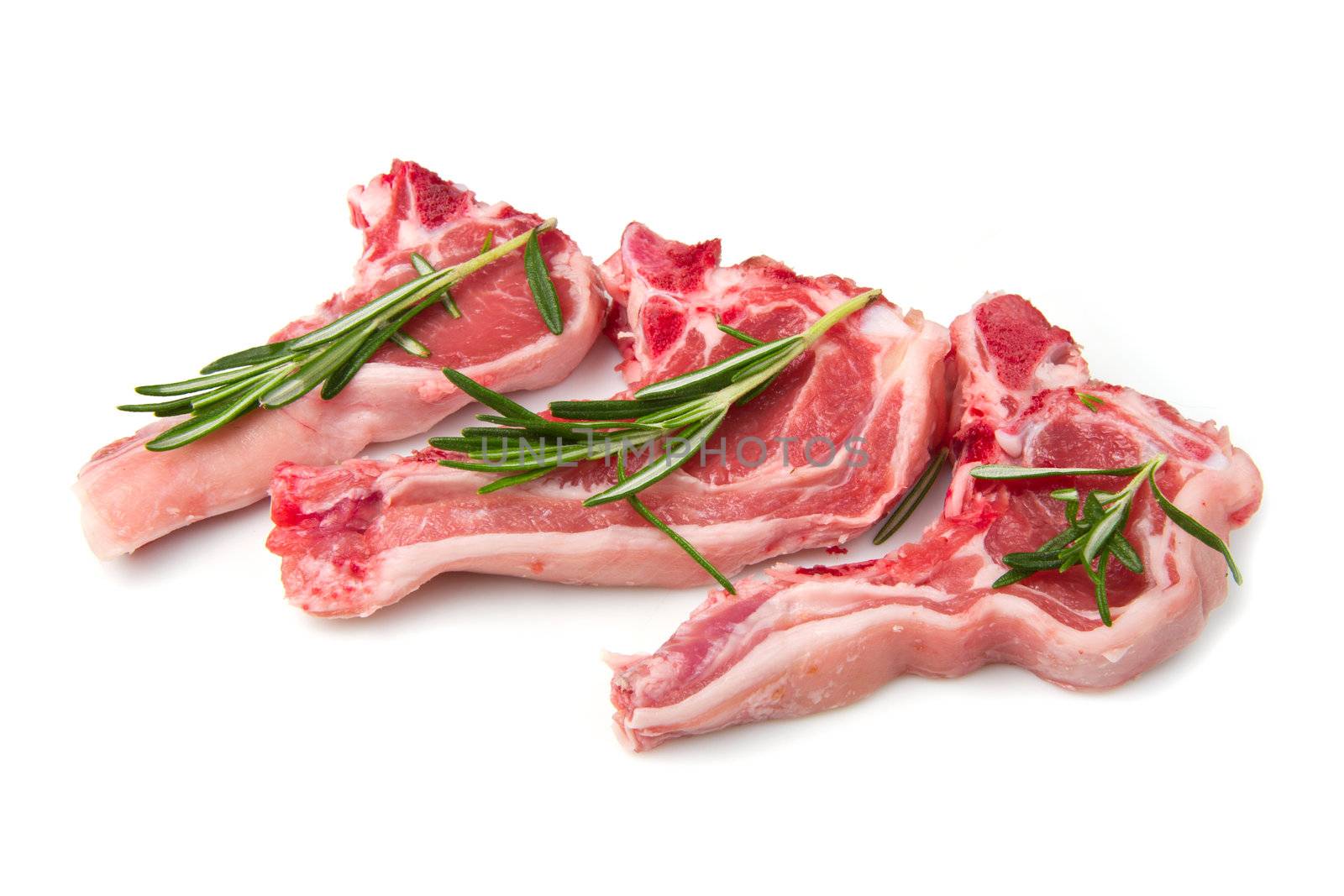 Racks of lamb, ready for cooking, with fresh rosemary