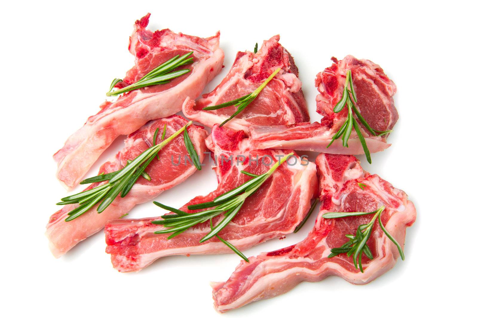 Racks of lamb, ready for cooking, with fresh rosemary