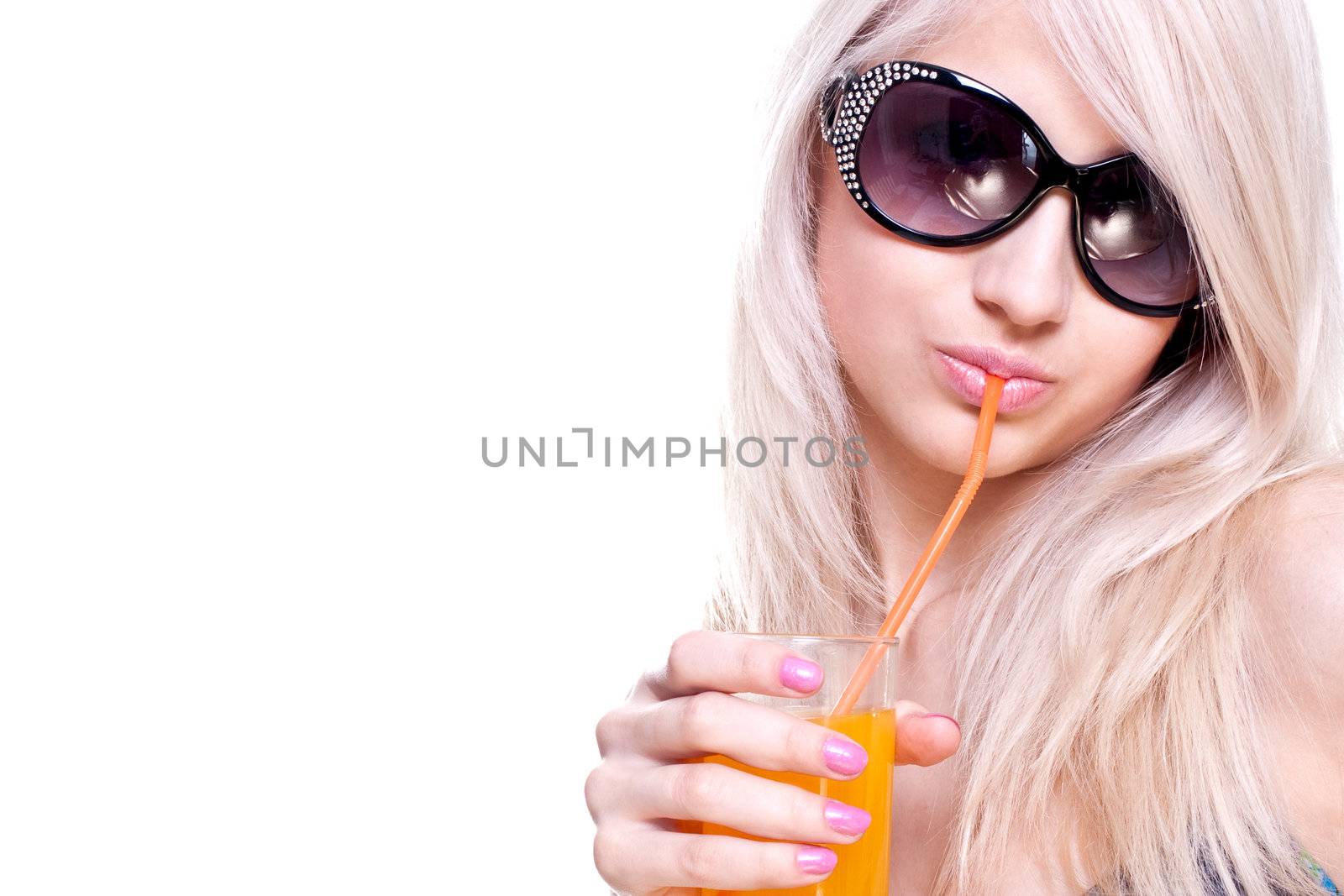 beautiful women in swimsuit with a glass of juice on a white background isolated