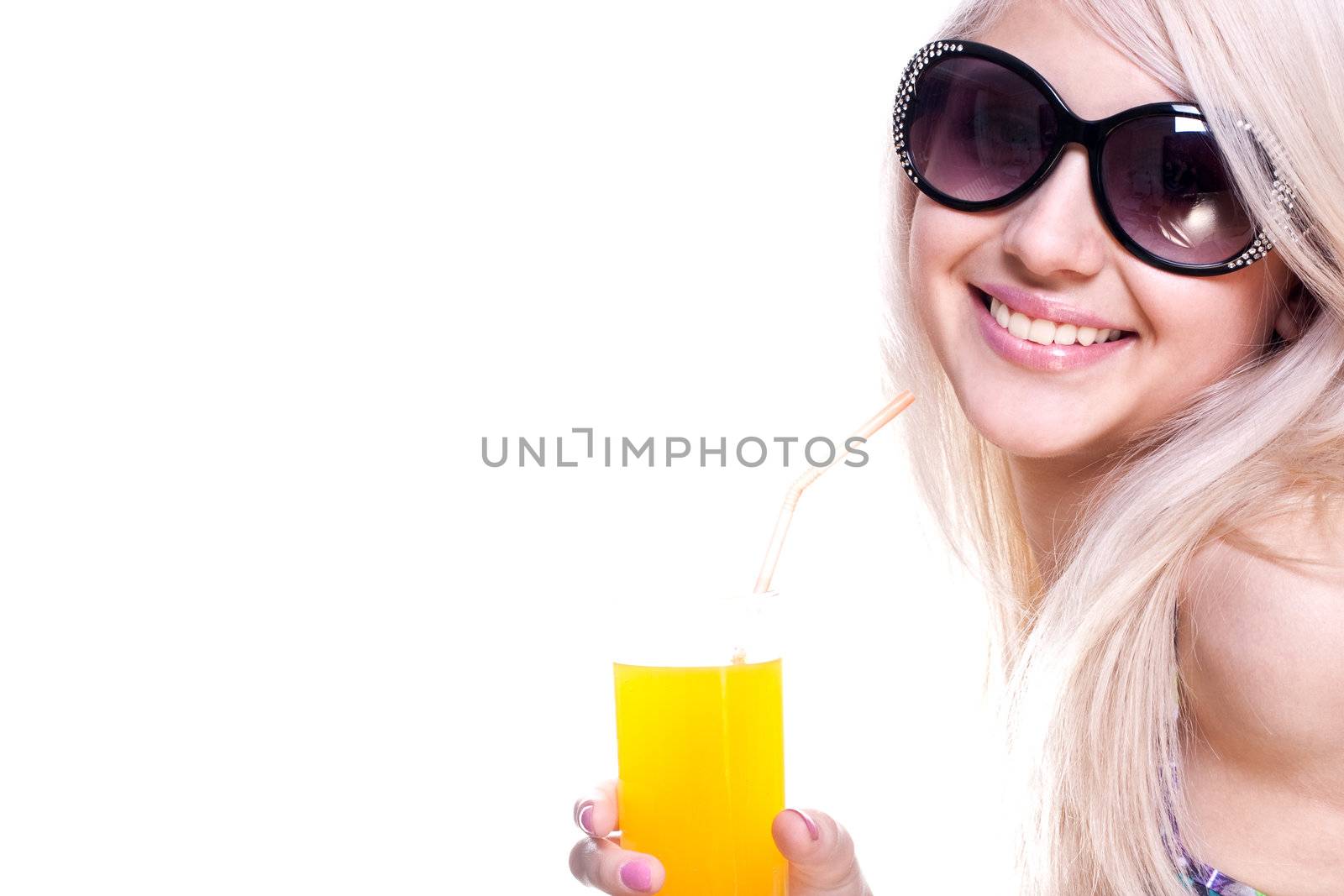 beautiful women in swimsuit with a glass of juice on a white background isolated