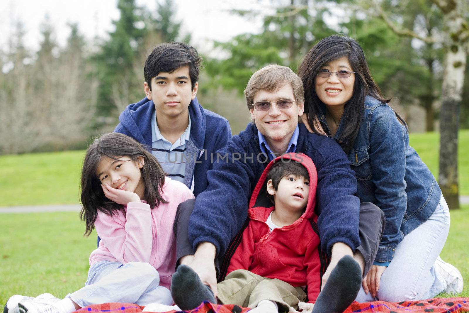 Happy interracial family enjoying a day at the park