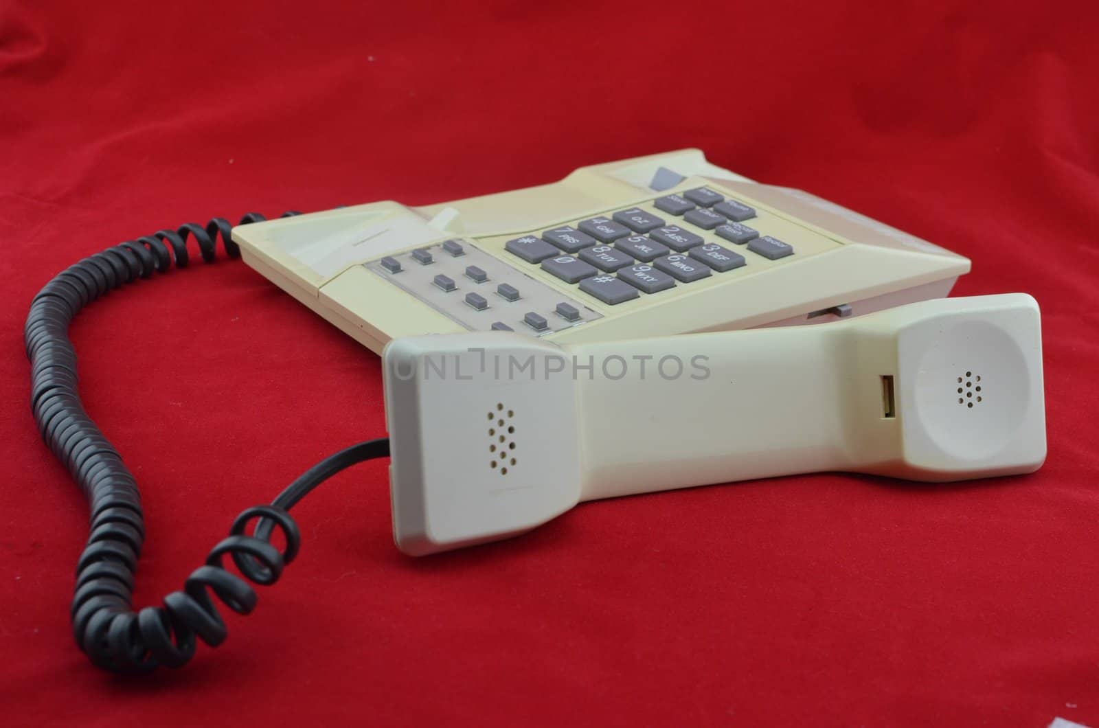 Telephone on red background