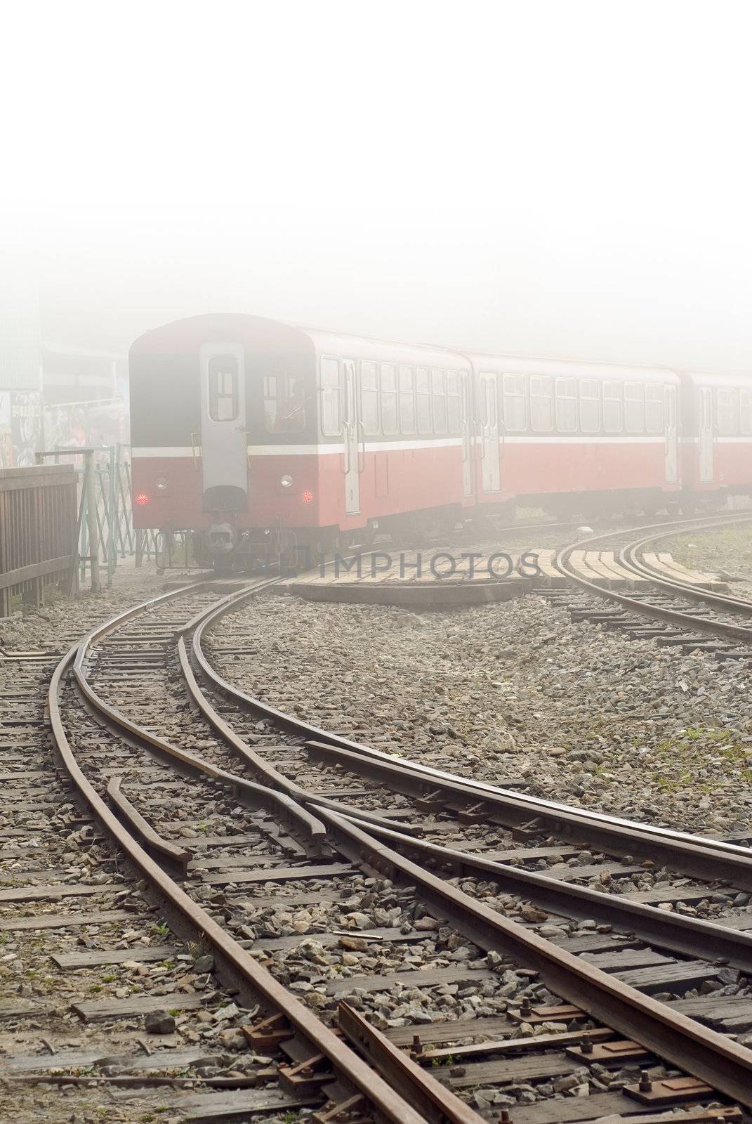 Train and railway in mist in Alishan National Scenic Area, Taiwan, Asia.