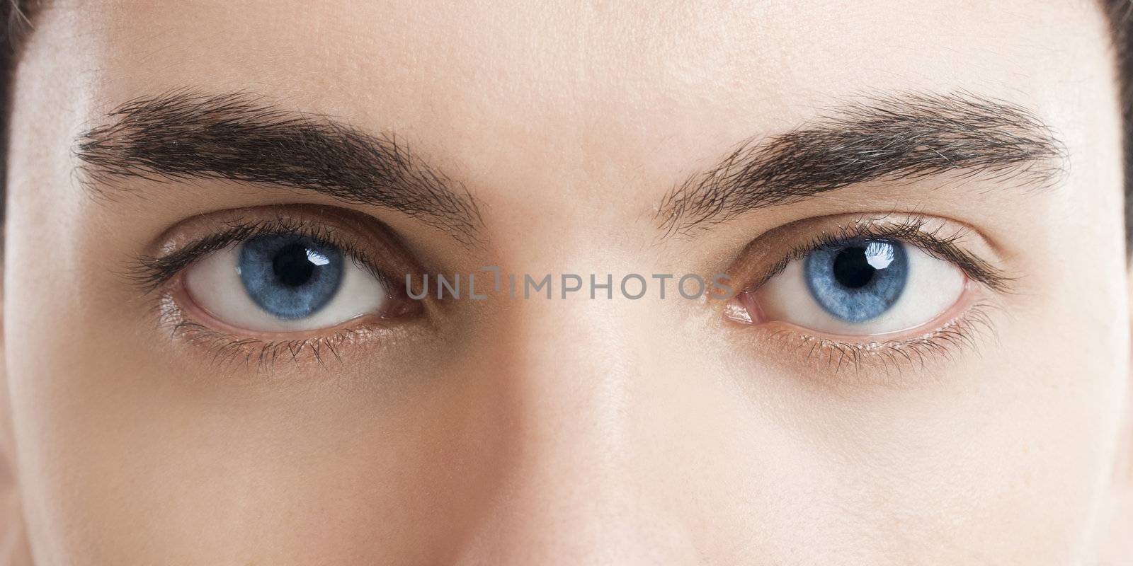 Close-up picture of blue eyes from a young man
